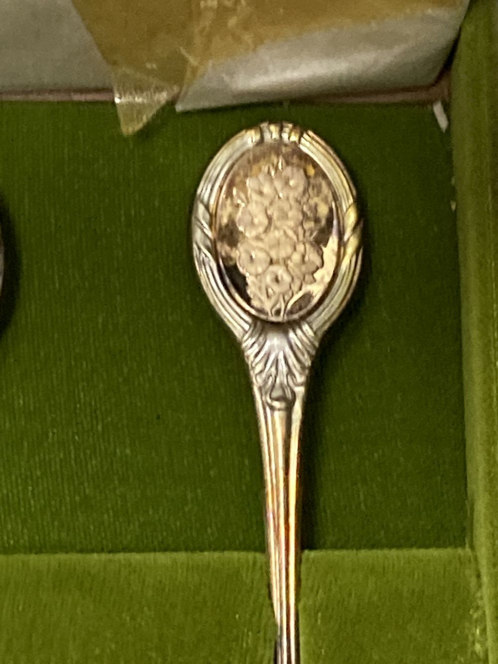 A modern cased set of twelve parcel gilt silver Royal Horticultural Society Flower Spoons by John Pinches,